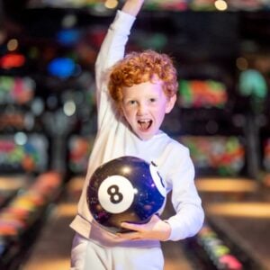 Young boy bowling